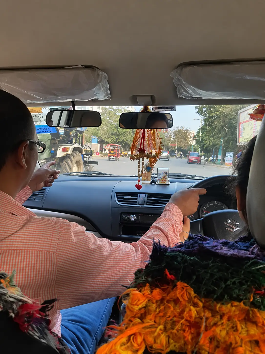 Driving instructor guiding a learner during an on-road lesson in Ghaziabad